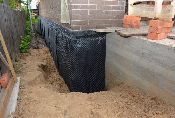 SJ Waterproofing Pros technician performing targeted Waterproofing assessment in Poynette, WI